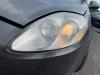Headlight, left from a Fiat Bravo (198A), 2006 / 2014 1.4 16V, Hatchback, Petrol, 1.368cc, 66kW (90pk), FWD, 192B2000; EURO4, 2007-04 / 2014-12, 198AXA1B 2007