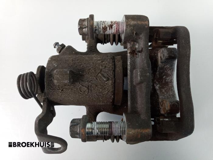 Rear brake calliper, left from a Opel Zafira (M75) 1.7 CDTi 16V 2011