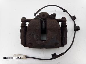 Used Front brake calliper, left Mini Mini (R56) 1.4 16V One Price € 25,00 Margin scheme offered by Autobedrijf Broekhuis B.V.