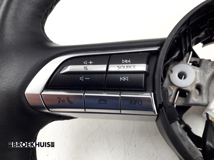 Steering wheel from a Mazda CX-30 (DM) 2.0 e-SkyActiv X 186 16V 2021