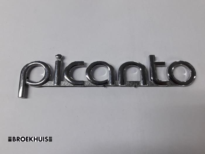 Emblem van een Kia Picanto (TA) 1.0 12V 2011