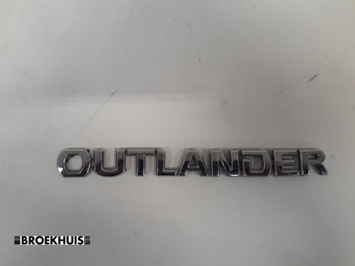 Używane Emblemat Mitsubishi Outlander (GF/GG) 2.0 16V PHEV 4x4 Cena € 30,00 Procedura marży oferowane przez Autobedrijf Broekhuis B.V.