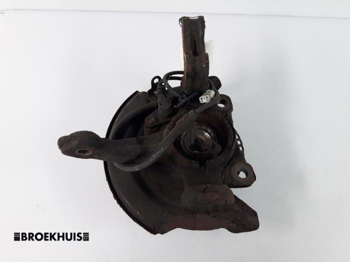 Knuckle, front left from a Daihatsu Sirion 2 (M3) 1.0 12V DVVT 2008