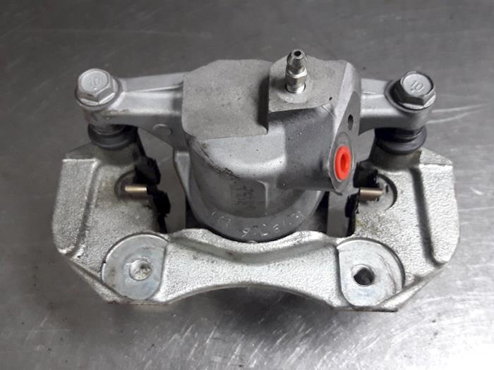 Rear brake calliper, left from a Toyota Prius Plus (ZVW4) 1.8 16V 2012