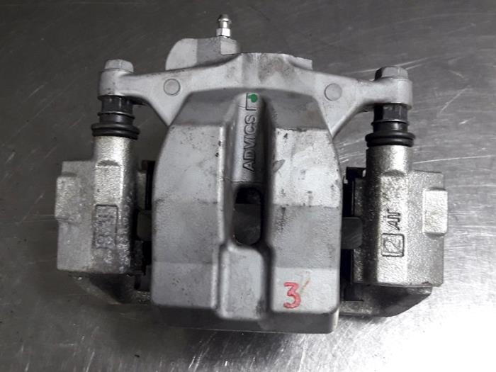 Rear brake calliper, left from a Toyota Prius Plus (ZVW4) 1.8 16V 2012