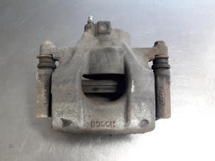 Used Front brake calliper, right Peugeot 107 1.0 12V Price € 15,00 Margin scheme offered by Autobedrijf Broekhuis B.V.