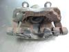 Front brake calliper, left from a Ford Focus 3 Wagon 1.6 TDCi ECOnetic 2013
