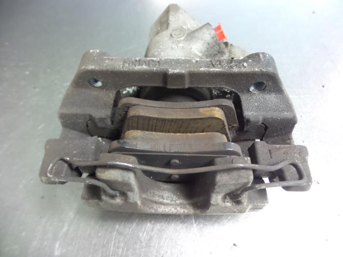 Rear brake calliper, left from a Ford Focus 3 Wagon 1.6 SCTi 16V 2012
