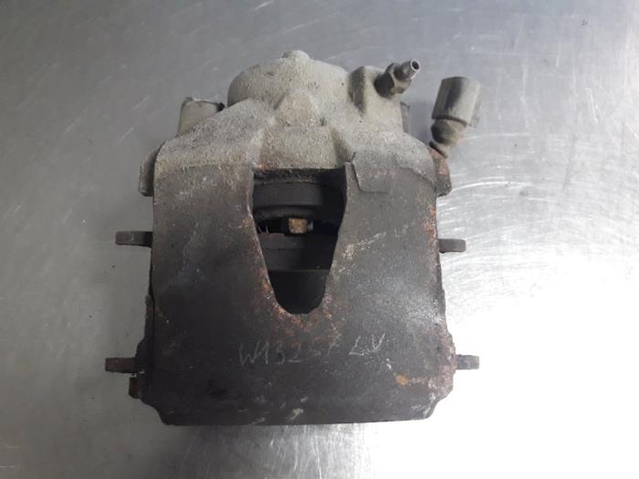 Front brake calliper, left from a Skoda Roomster (5J) 1.4 TDI 70 2009