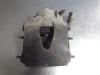Front brake calliper, left from a Skoda Roomster (5J) 1.4 TDI 70 2009