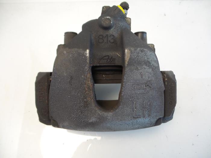 Front brake calliper, left from a Volvo V40 (MV) 2.0 D2 16V 2015