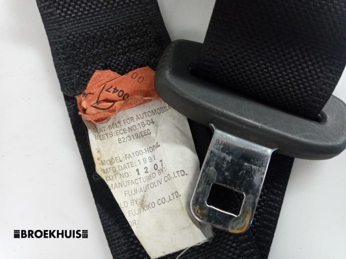 Rear seatbelt, left from a Nissan Sunny (N14) 1.4 16V 1991