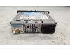 Radio CD player from a Renault Megane III Grandtour (KZ) 1.4 16V TCe 130 2010