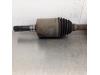 Front drive shaft, left from a Jeep Cherokee/Liberty (KJ) 2.4 16V 2003
