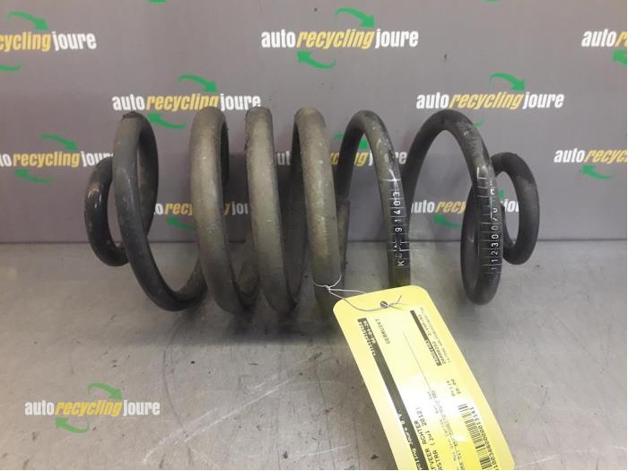 Rear coil spring from a Opel Astra J Sports Tourer (PD8/PE8/PF8) 2.0 CDTI 16V 165 2012
