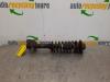 Front shock absorber rod, left from a Suzuki Wagon-R+ (RB) 1.3 16V 2001