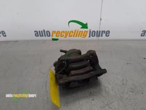 Used Front brake calliper, left Nissan Note (E11) 1.4 16V Price € 24,99 Margin scheme offered by Autorecycling Joure B.V.