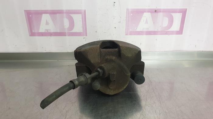 Front brake calliper, left from a Ford Focus 3 Wagon 1.6 TDCi 115 2012