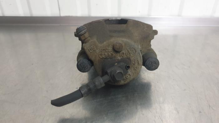 Front brake calliper, left from a Volkswagen Polo V (6R) 1.2 TDI 12V BlueMotion 2011