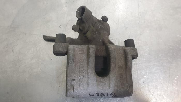Rear brake calliper, left from a Volvo V40 (MV) 1.6 D2 2014