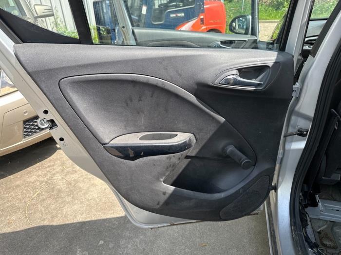 Rear door trim 4-door, left from a Opel Corsa E 1.2 16V 2016