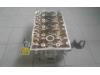 Cylinder head from a Opel Astra H GTC (L08) 1.6 16V 2010