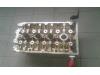 Cylinder head from a Opel Astra H GTC (L08) 1.6 16V 2010