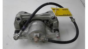 Used Front brake calliper, left Nissan Qashqai (J11) 1.3 DIG-T 160 16V Price € 99,00 Margin scheme offered by Autobedrijf G.H. Wessel B.V.