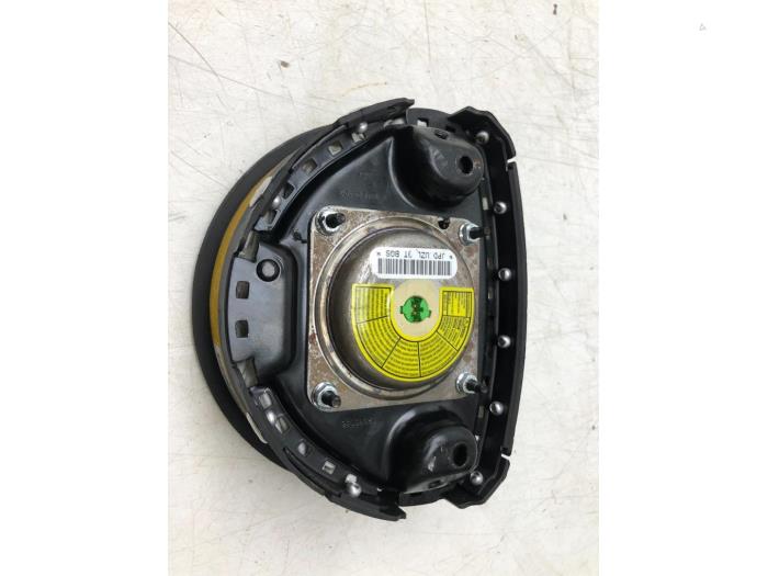 Left airbag (steering wheel) from a Vauxhall Combo Mk.II (Corsa) 1.3 CDTI 16V 2008