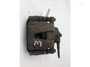 Used Front brake calliper, left Opel Corsa D 1.2 16V Price € 45,00 Margin scheme offered by Autobedrijf G.H. Wessel B.V.