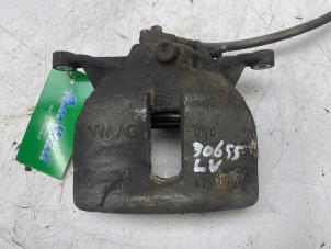 Used Front brake calliper, left Seat Leon (5FB) 1.6 TDI 16V Price € 49,00 Margin scheme offered by Autobedrijf G.H. Wessel B.V.