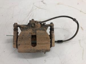 Used Front brake calliper, left Volkswagen Passat Variant (3G5) 2.0 TDI 16V 150 Price € 39,00 Margin scheme offered by Autobedrijf G.H. Wessel B.V.