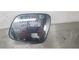 Used Mirror glass, left Chevrolet Spark 1.0 16V Price € 20,00 Margin scheme offered by De Witte Boerderij B.V.