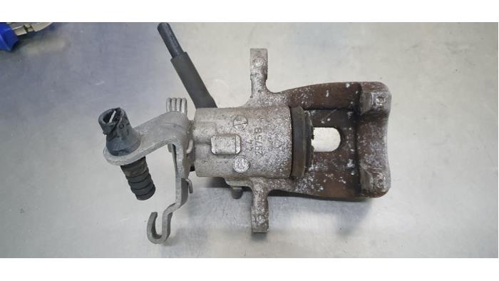 Rear brake calliper, left from a Skoda Octavia Combi (5EAC) 1.4 TSI 16V 2016