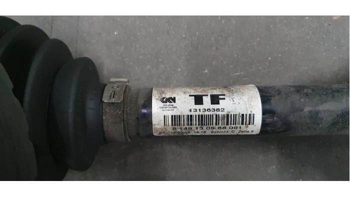Front drive shaft, left from a Opel Zafira B 2010