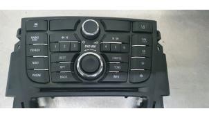 Used Radio control panel Opel Astra J (PC6/PD6/PE6/PF6) 1.4 Turbo 16V Price € 65,00 Margin scheme offered by De Witte Boerderij B.V.