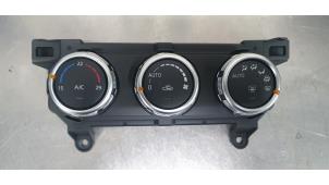 Usados Panel de control de calefacción Mazda 2 (DJ/DL) 1.5 e-SkyActiv G 90 Precio € 75,00 Norma de margen ofrecido por De Witte Boerderij B.V.