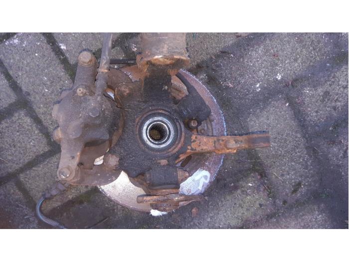 Front brake calliperholder, right from a Opel Corsa C (F08/68) 1.0 12V 2002