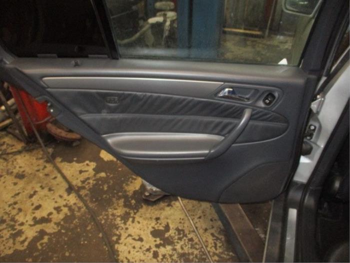 Rear door trim 4-door, left from a Mercedes-Benz C Combi (S203) 2.6 C-240 18V 2002