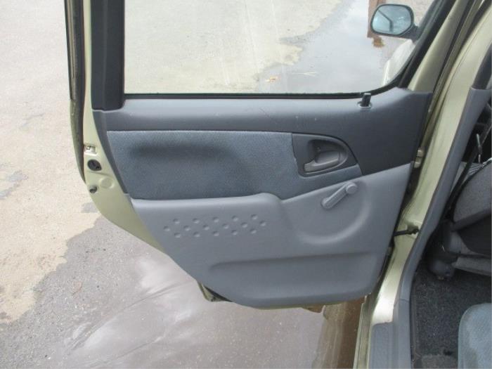 Rear door trim 4-door, left from a Toyota Yaris Verso (P2) 1.5 16V 2000