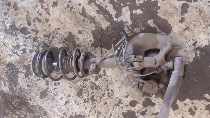 Front brake calliper, left from a BMW 3 serie Touring (E46/3) 318i 2000