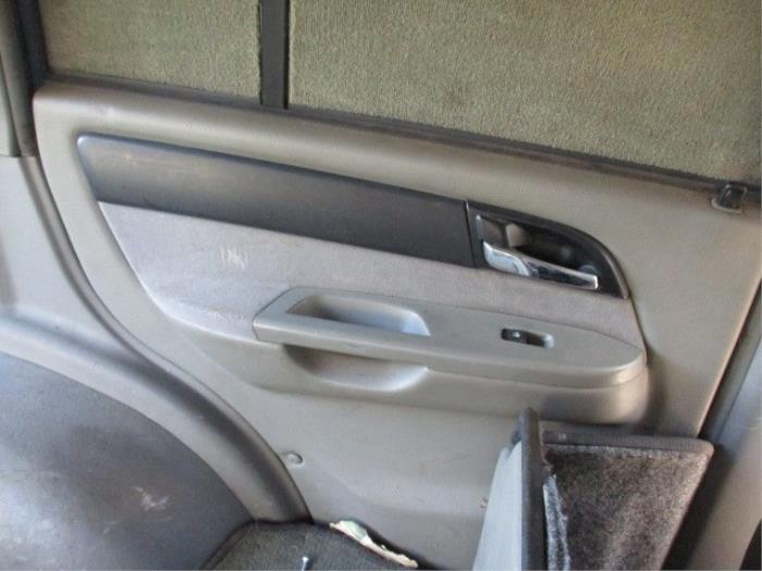 Rear door trim 4-door, left from a SsangYong Musso 2.9TD 2004
