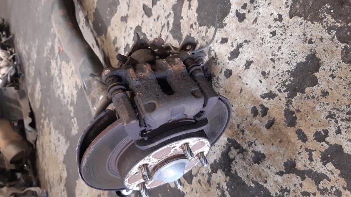 Rear brake calliperholder, left from a Honda Civic (FK/FN) 1.4 i-Dsi 2006