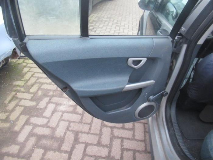 Rear door handle 4-door, left from a Smart Forfour (454) 1.3 16V 2004
