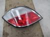 Taillight, left from a Opel Astra H (L48) 1.4 16V Twinport 2004