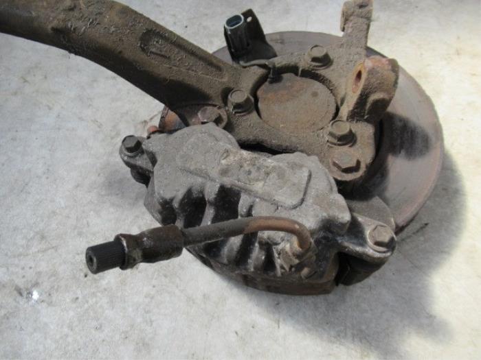 Front brake calliper, left from a Cadillac CTS I 3.6 V6 24V 2006