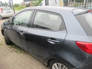 Używane Drzwi lewe tylne wersja 4-drzwiowa Mazda 2 (DE) 1.4 CDVi 16V Cena € 150,00 Procedura marży oferowane przez Boekholt autodemontage B.V