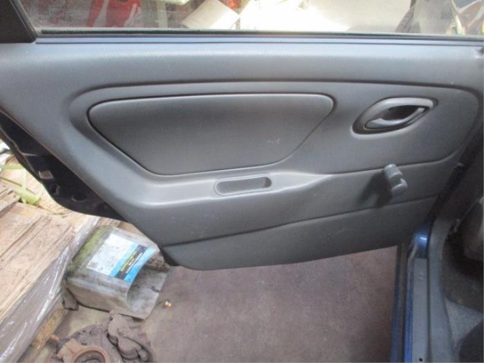 Rear door trim 4-door, left from a Suzuki Alto (RF410) 1.1 16V 2003