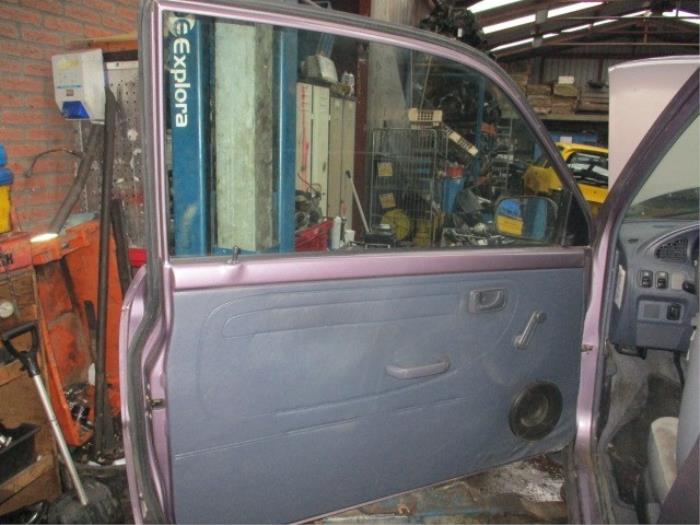 Door trim 2-door, left from a Daihatsu Cuore (L251/271/276) 850,Domino 1998