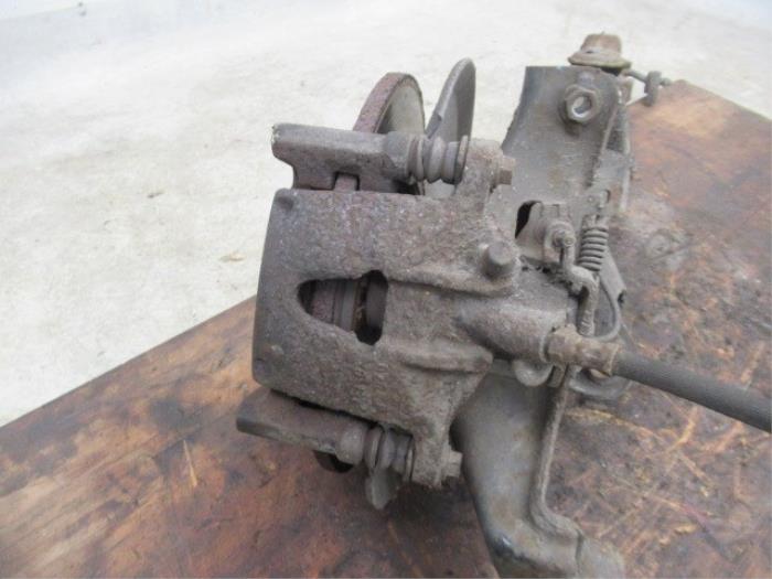 Rear brake calliper, left from a Ford Mondeo III Wagon 1.8 16V SCI 2004